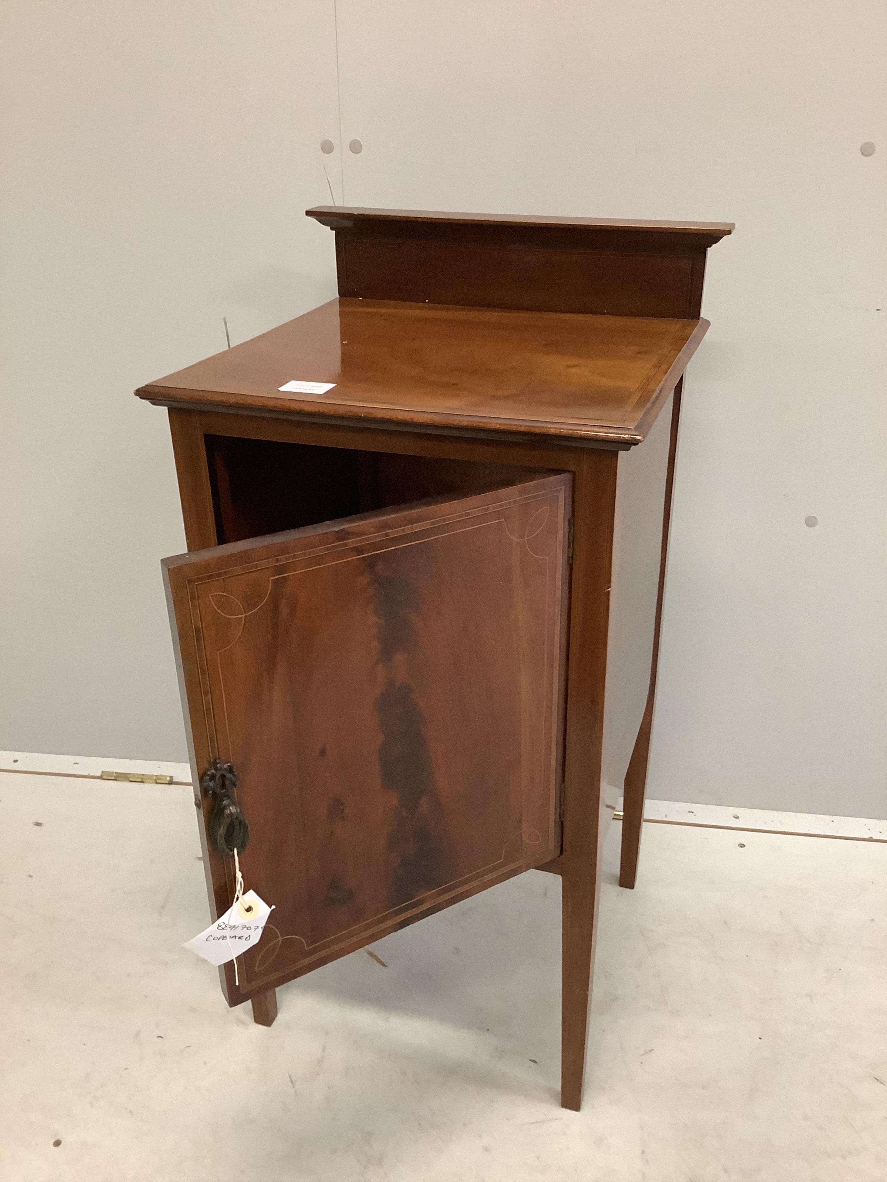 An Edwardian mahogany bedside cabinet on square tapered legs, width 42cm, depth 41cm, height 83cm. Condition - fair